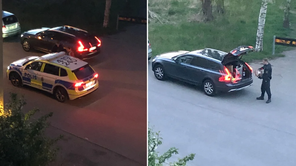 Två personer greps och polisen lastade enligt vittnen in ett antal lådor och en säck i bilarna.