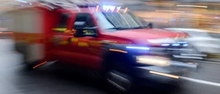Larm om brand i flerfamiljshus 