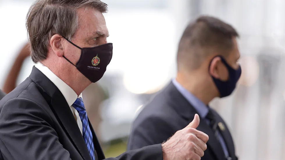 Brasiliens regering, med president Jair Bolsonaro i spetsen, slutar att offentliggöra den mesta statistiken över landets stora utbrott av covid-19. Bilden är från 18 maj 2020.