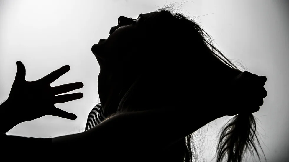En 52-årig man misstänks ha misshandlat en kvinna framför hennes barn. 