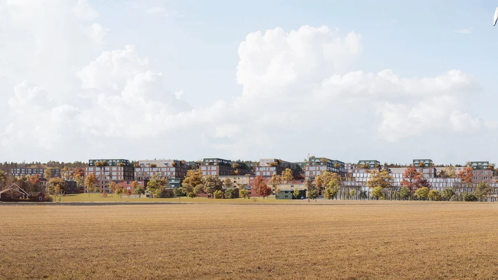 Så här väntas den nya stadsdelen se ut från åkrarna öster om järnvägen. Till höger i bild ligger en skissad version av en simhall och strax bakom den tågstationen.