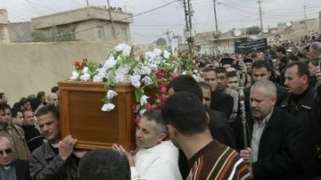 Mourners carry the coffin of Archbishop Paulos Faraj Rahho, during his funeral in a village outside Mosul in northern Iraq, Friday, March 14, 2008. Rahho, was kidnapped by unknown gunmen two weeks ago, just minutes after performing mass, in Mosul, a city the U.S. military considers the last urban stronghold of al-Qaida in Iraq.(AP photo)