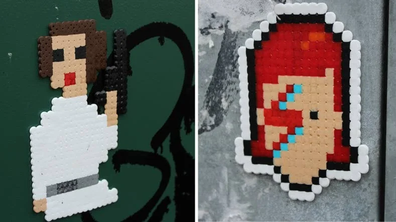 Pärlplattegraffiti. David Bowie och Carrie Fisher, som båda dog 2016, hyllas på ett ovanligt sött vis i Vasaparken i Norrköping.