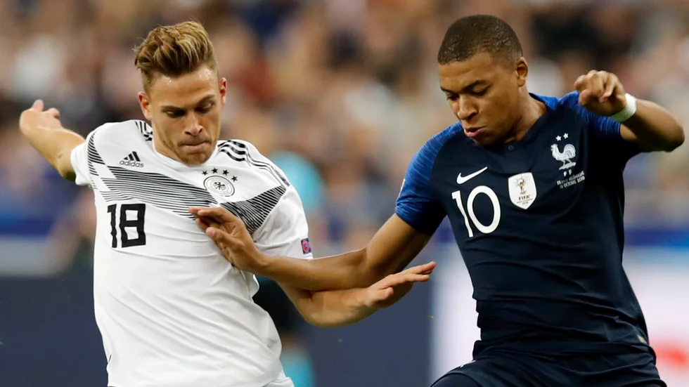 Tysklands Joshua Kimmich och Frankrikes Kylian Mbappé i Nations League-mötet 2018. Nu kan de mötas igen i EM.