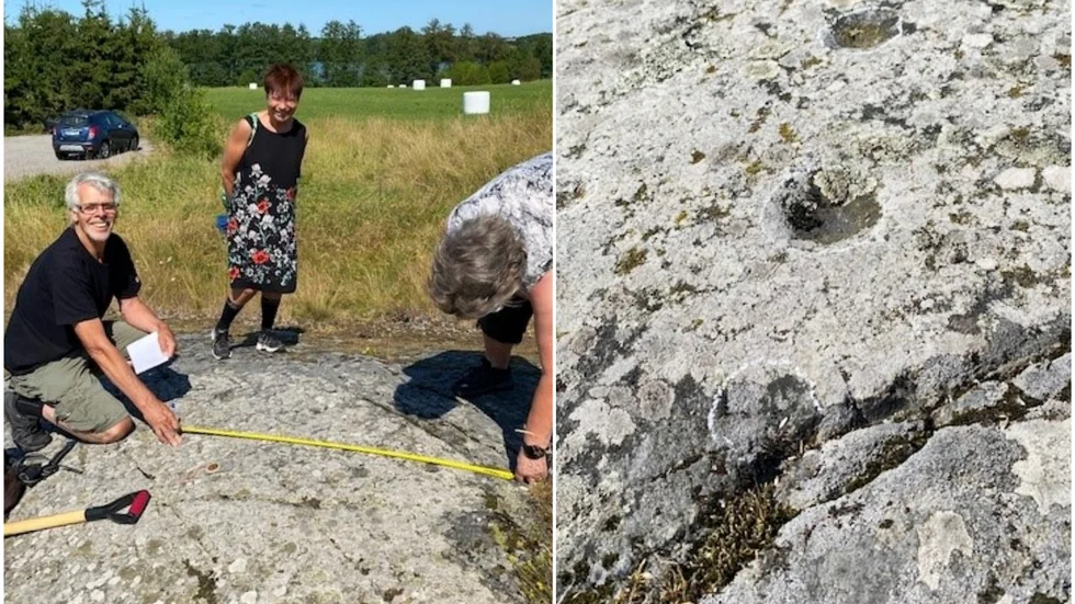 Sven-Gunnar Broström, Björnlundabon Monika Jansson och Birgitta Broström vid stenhällen med skålgropar.