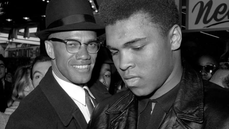 anhängare. Muhammad Ali, världsmästaren i boxning med Malcolm X, sedan Ali anslutit sig till islam.