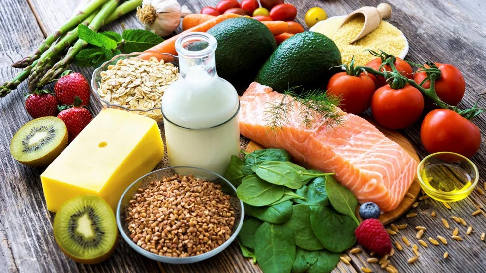 Selection of healthy food on rustic wooden background
