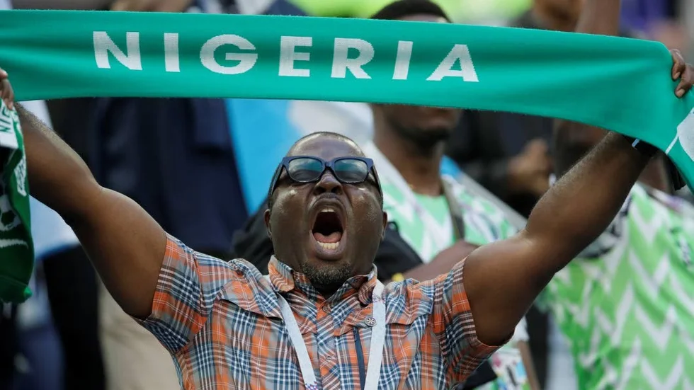 Nigeria soccer fan cheers during the group D match between Argentina and Nigeria at the 2018 soccer World Cup in the St. Petersburg Stadium in St. Petersburg, Russia, Tuesday, June 26, 2018. (AP Photo/Dmitri Lovetsky)