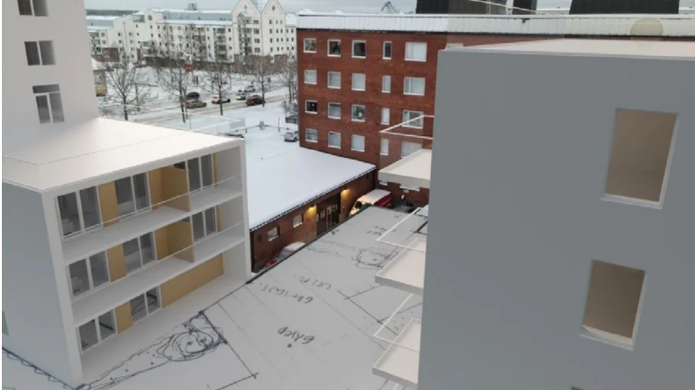Kvarteret Öringen i Luleå centrum, föreslagen ny bebyggelse i vitt som placeras på innergården mellan två hyreshus, det ena skymtar bakom nybyggnaderna.