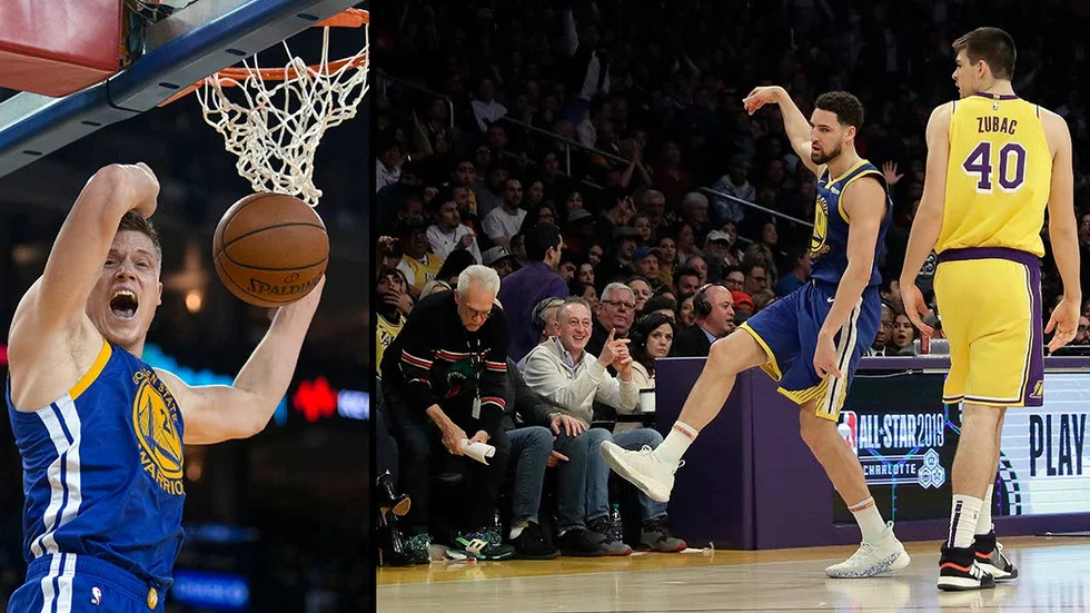 Jonas Jerebko och Klay Thompson.