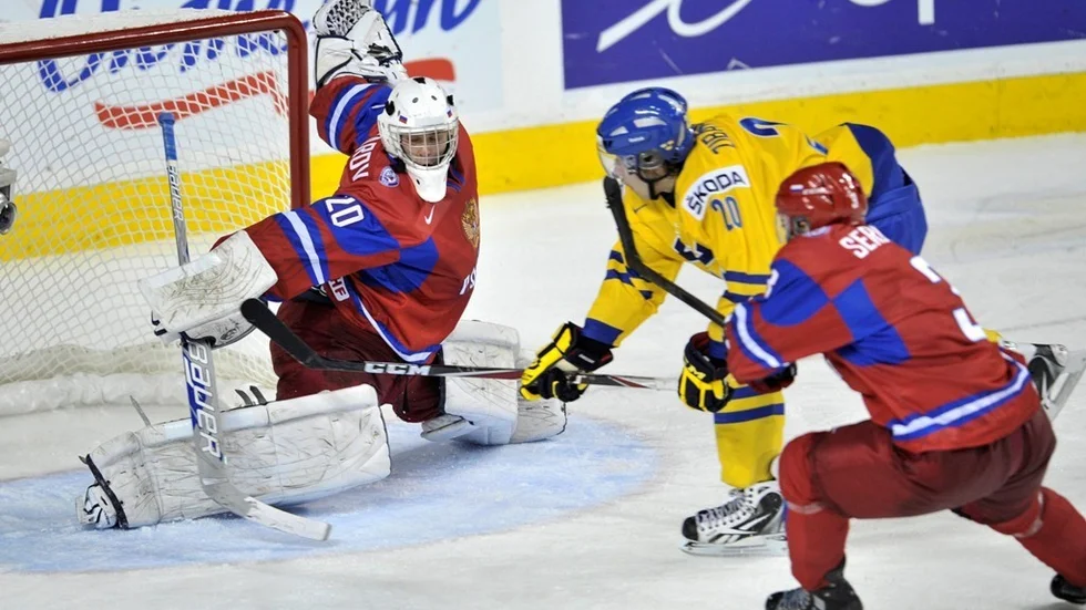 Sweden's Mika Zibanejad scores past Russia goaltender Andrei Makarov in overtime in world junior hockey championships title game Thursday, Jan. 5, 2012, in Calgary, Alberta. Sweden won 1-0. (AP Photo/The Canadian Press, Nathan Denette)