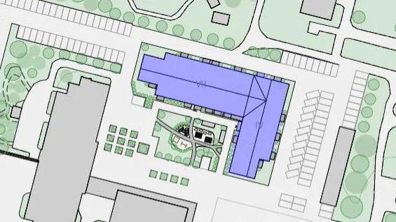 Huset som ska byggas är markerat med lila. Grå byggnader är befintliga på området. 