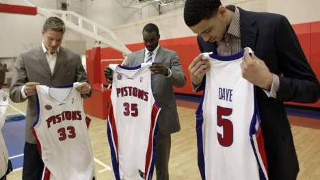 Jonas Jerebko (33), of Sweden, DaJuan Summers  (35) and Austin Daye (5) look at their jerseys after a news conference Monday, June 29, 2009 in Auburn Hills, Mich.  (AP Photo/Pa