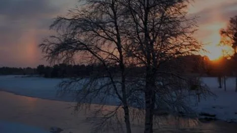 Soluppgång i dublett vid Lillströmmen i Arjeplog.