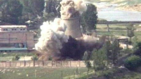 *** THIRD OF FIVE *** This image from television shows the demolition of the 60-foot-tall cooling tower at its main reactor complex in Yongbyon North Korea Friday June 27, 2008. North Korea destroyed the most visible symbol of its nuclear weapons program Friday in a sign of its commitment to stop making plutonium for atomic bombs. (AP Photo/APTN)