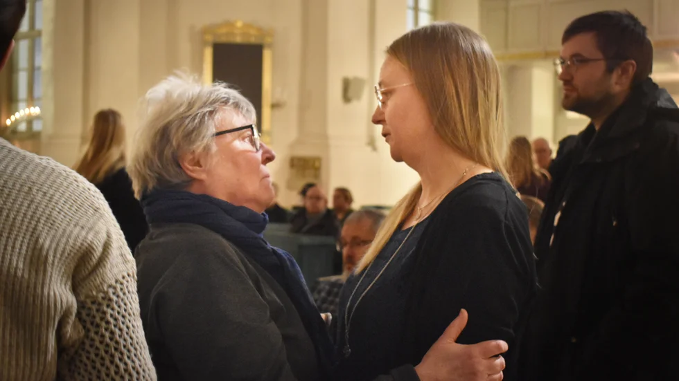 Elliott's mum, Anna Larsson (right) being comforted.