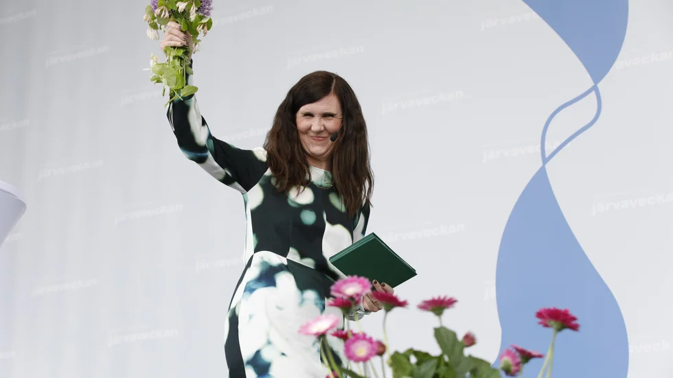 Miljöpartiets språkrör Märta Stenevi (MP) talar under Järvaveckan på Spånga IP. Arkivbild.