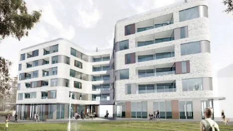 Här ser man de två ihopbyggda planerade hyreshusen bakom Strömparken.