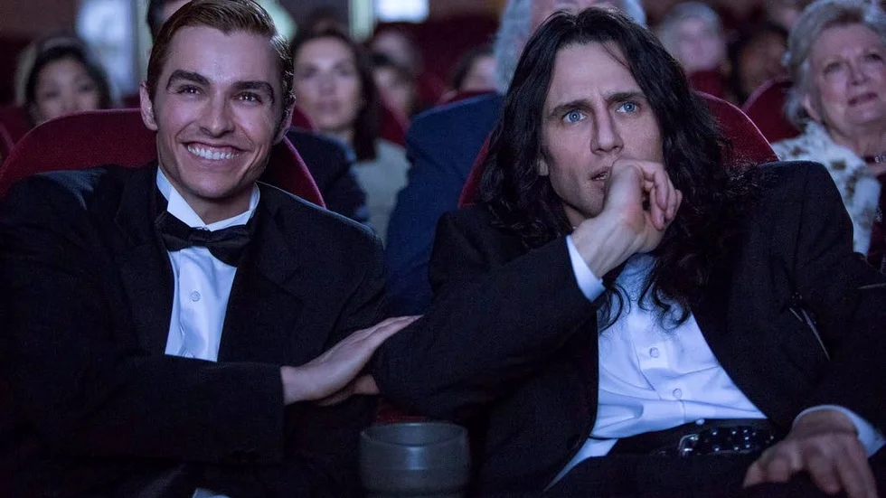 This image released by A24 shows Dave Franco, left, and James Franco in a scene from "The Disaster Artist."  On Monday, Dec. 11, 2017, James Franco was nominated for a Golden Globe for best actor in a motion picture comedy or musical for his role in the film. The 75th Golden Globe Awards will be held on Sunday, Jan. 7, 2018 on NBC. (Justina Mintz/A24 via AP)