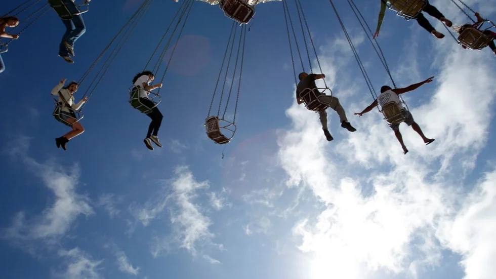 People swing on a ride at the San Diego County Fair, Friday, June 17, 2011, in Del Mar, Calif. The fair runs through July 4. (AP Photo/Gregory Bull)