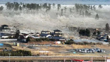 Waves of tsunami hit residences after a powerful earthquake in Natori, Miyagi prefecture (state), Japan, Friday, March 11, 2011.  The largest earthquake in Japan's recorded history slammed the eastern coast Friday. (AP Photo/Kyodo News) MANDATORY CREDIT, NO LICENSING ALLOWED IN CHINA, HONG KONG, JAPAN, SOUTH KOREA AND FRANCE