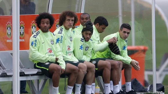 Brazilian players, from left, Marcelo, David Luiz, Neymar, Fernandinho, Thiago Silva, and Oscar, sit on the bench during a training session at the Granja Comary training center in Teresopolis, Brazil, Tuesday, July 1, 2014. Brazil will face Colombia on July 4 in the quarter-final of the 2014 soccer World Cup. (AP Photo/Andre Penner)
