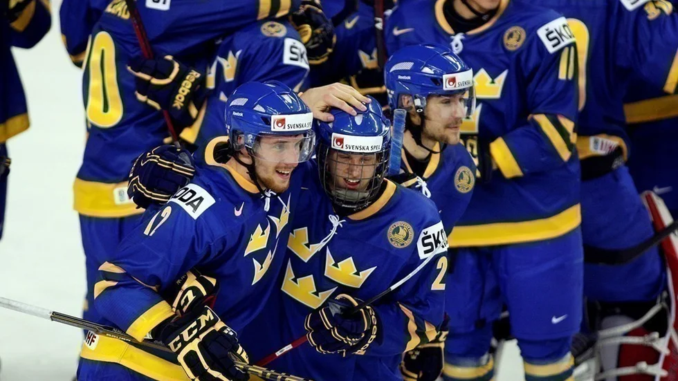 Team Sweden's Patrik Nemeth, bottom left, celebrates beating Team Russia with teammate Jonas Brodin, bottom right, following overtime IIHF World Junior Championships hockey action in Calgary, Alberta., Saturday, Dec. 31, 2011. Team Sweden won 4-3. (AP Photo/THE CANADIAN PRESS/Jeff McIntosh)