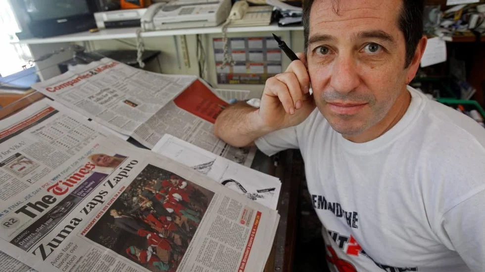 Den sydafrikanske tecknaren Jonathan "Zapiro" Shapiro är en av alla som uttryckt sina reaktioner på attacken.
Foto: Schalk van Zuydam/AP/TT