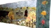 Den färgrika väggbonaden som nu hänger i Vallonskolans matsal i Gimo, tillverkades 1992 av elever vid Reuterskiöldska skolan i Hökhuvud.