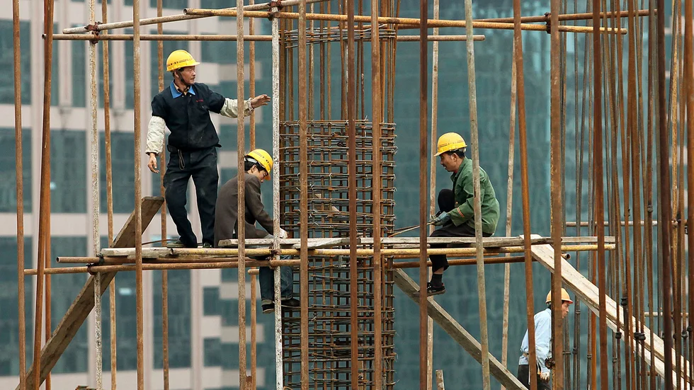 Byggnadsarbetare i Shanghai, Kina. Arkivbild.