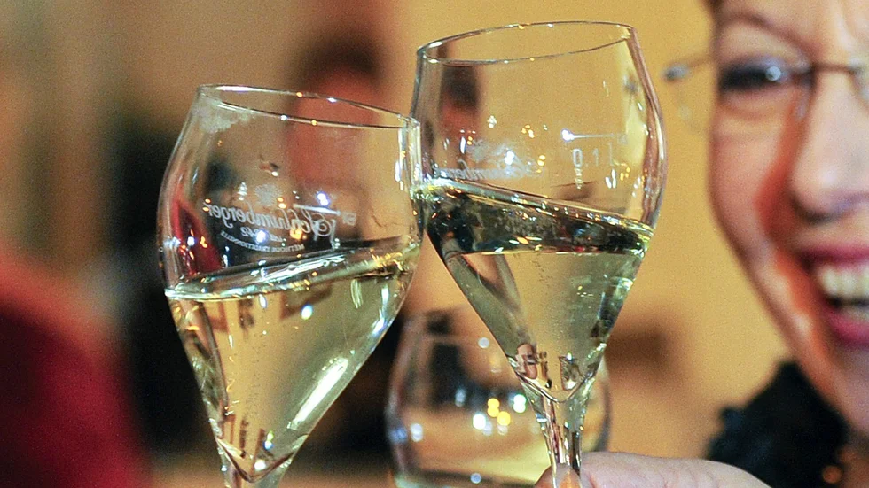 In this picture taken Saturday, Feb. 1, 2014 guests of the Ball de Pharmacy toast with their glasses of sparkling wine at the Hofburg palace in Vienna, Austria. Just when it seemed that Austria survived the Eurocrisis unscathed, austerity has hit _ in the form of a tax on sekt, the countrys version of champagne. At less than one euro a bottle, the planned levy pales in severity compared to the hardships imposed on citizens of other EU nations worst hit by the past five years of economic meltdown, It is also only one of several tax hikes that will see Austrians also paying more for luxury cars and tobacco products as of next month _ yet it seems to be causing the most furor. (AP Photo/Hans Punz)