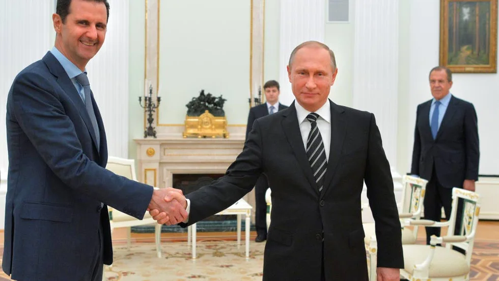 HANDSLAG. Syriens president al-Assad och Rysslands president Vladimir Putin träffades i Kreml 20 oktober 2015.