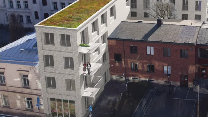 Ett bostadshus i fyra våningar får enligt detaljplanen byggas direkt mot gamla tingshusets gavelfasad. Nu stoppas planen av domstol. 