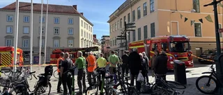 Lokal på torget rök- och vattenskadad efter brand