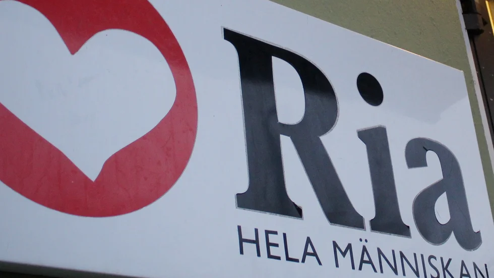 Ria hela människan skylt