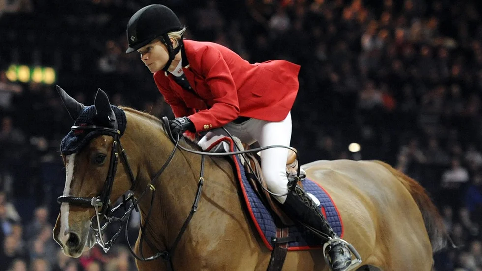 Sweden's Malin Baryard-Johansson on HM Reveur de Hurtebise is on her way to take the third place during the Rolex Grand Prix at the Equestrian Mercedes CSI in Zurich, Switzerland, Friday, Jan. 27, 2012. (AP Photo/Keystone/Walter Bieri)