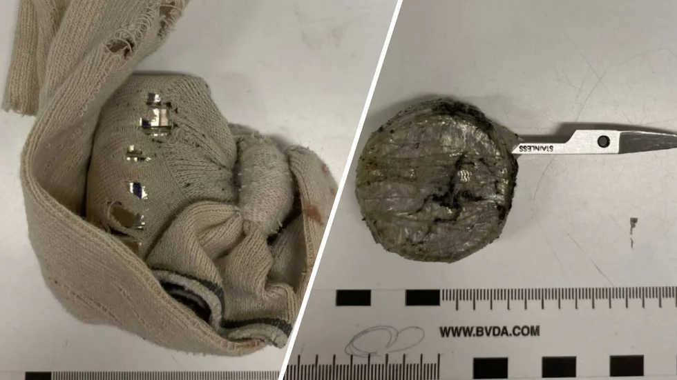 Mannens tillhyggen. Magneter i en strumpa och bladet från en nagelsax, som han tejpat fast vid något han kunde hålla i. 