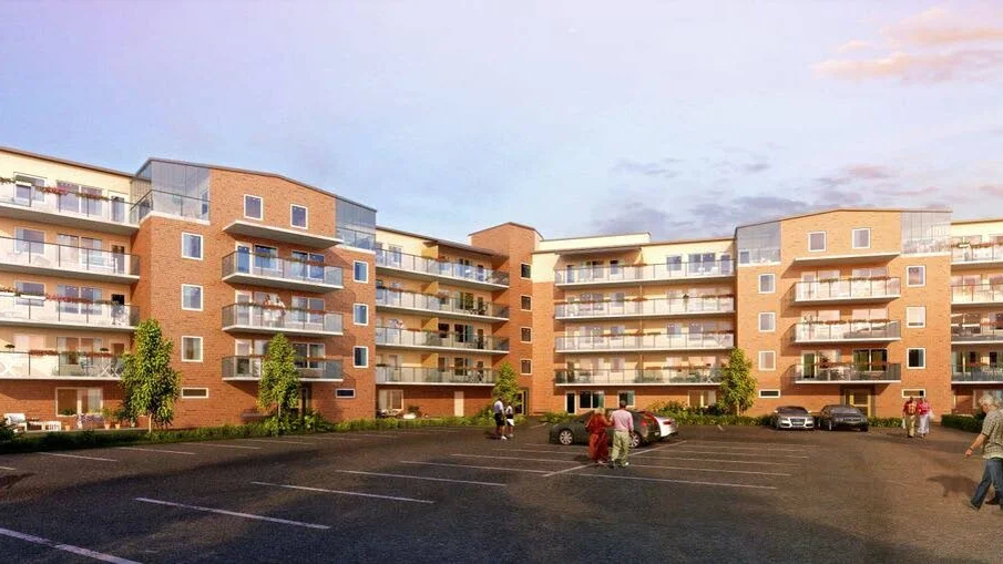 Montage. Så här tänker sig Riksbyggen att det färdiga huset ska se ut. Det kommer att ligga på samma tomt som de tre punkthus som byggs i dag.
