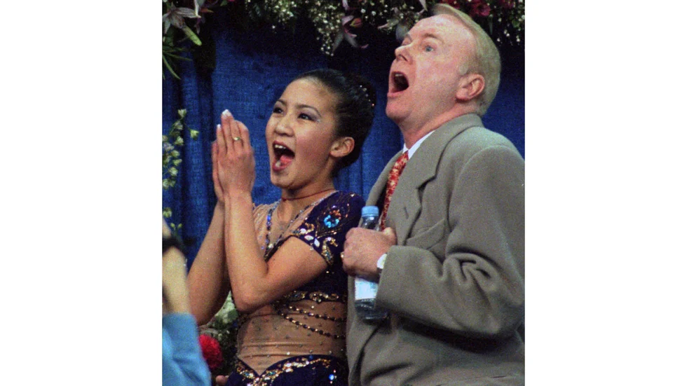 Frank Caroll med Michelle Kwan under konståknings-VM 1996. Arkivbild.