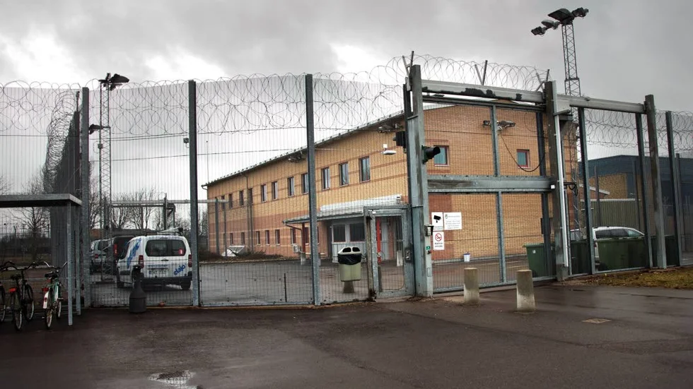 En fånge på Skänningeanstalten har åtalats för givande av muta.