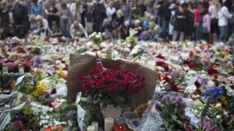 People gather during a memorial service at Oslo Cathedral in the aftermath of the Friday attacks on Norway's government headquarters and a youth retreat, in Oslo, Norway Sunday, July 24, 2011. The man blamed for the attacks which left at least 93 dead said he was motivated by a desire to bring about a revolution in Norwegian society, his lawyer said Sunday. (AP Photo/Emilio Morenatti)