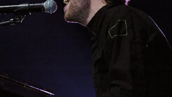 Coldplays Chris Martin var på strålande humör under måndagens konsert. Bild: Pressens bild