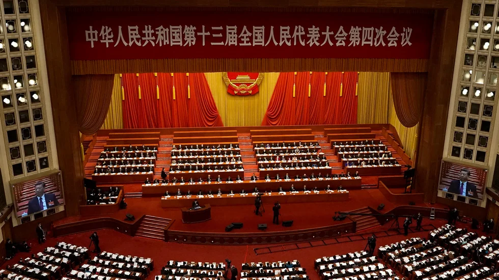 President Xi Jinping syntes på skärmar vid fjolårets nationella folkkongress i Peking. Arkivbild.
