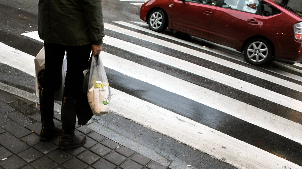 En ung man åtalas för vårdslöshet i trafik efter att ha kört på en gående på övergångsställe i Enköping.