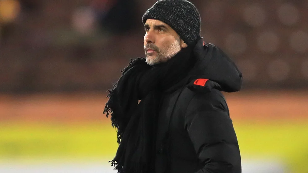 Pep Guardiola tonar ned snacket om att Manchester City kan ta fyra titlar de kommande månaderna. Arkivbild.