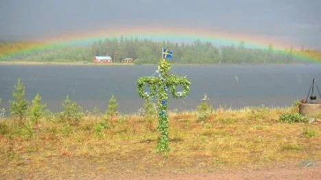 Regnbågen över Södra Trollselet i Piteälven, Arvidsjaurs kommun.