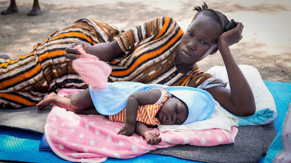 Kvinna och barn som flytt Sudan till Malakal i Sydsudan.