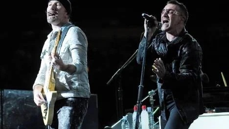 Guitarist The Edge, left, and lead singer Bono of the rock band U2 perform with the band during their 360 world tour stop at Giants Stadium in East Rutherford, NJ on Thursday, Sept. 24, 2009. (AP Photo/Evan Agostini)