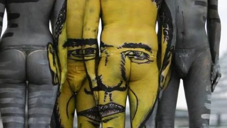 ** EDS NOTE NUDITY ** The portrait of U.S. President Barack Obama is seen as a body painting  during the performance 'The Fusion Journey' of Swiss artist 'Dave' (No Last Name) in Berlin on Thursday, May 21, 2009.  (AP Photo/Markus Schreiber)