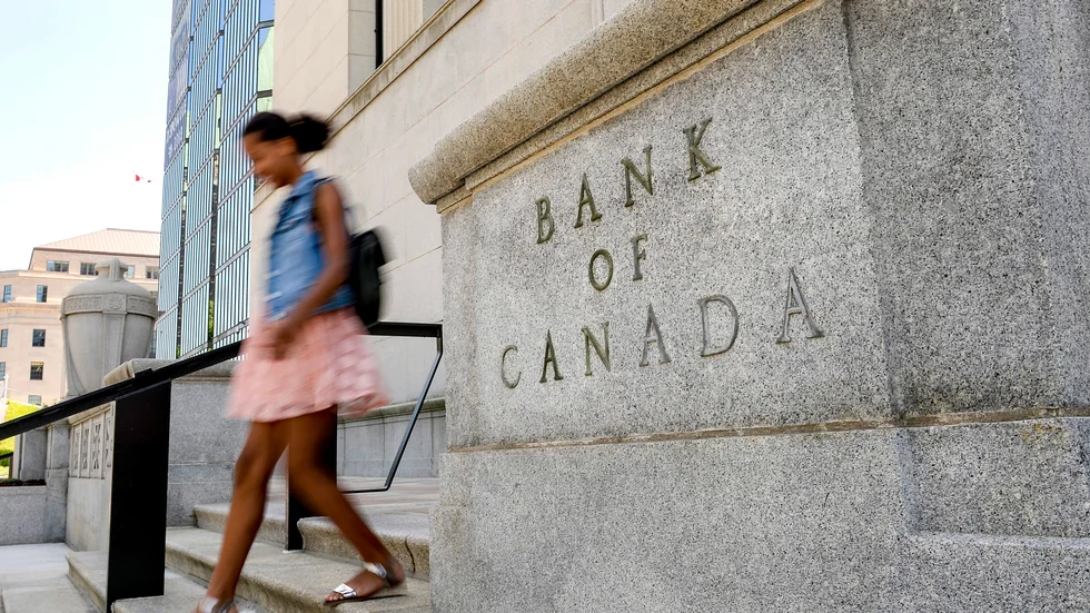 Bank of Canada drar ned på stödköpen och höjer inflationsprognosen. Arkivbild